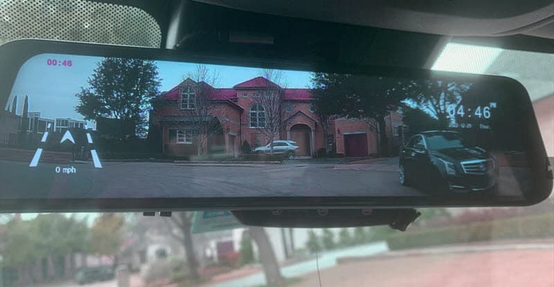 rearview mirror looking at home leaving