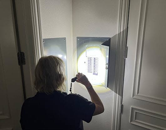 homewatcher checking breaker box