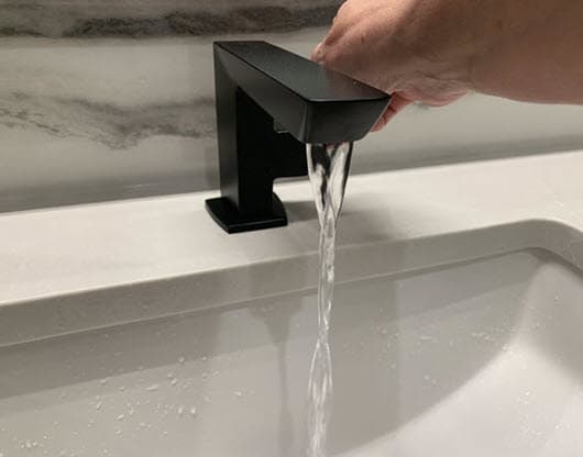 Running water faucet during a home watch inspection